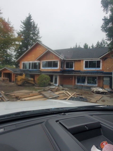 Custom home re-roof underway during construction in Langley, BC by Roofking