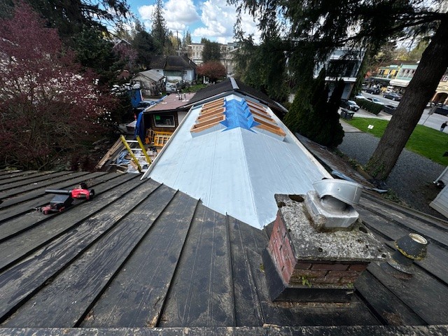Standing seam metal roof installation in progress in Langley, BC by Roofking