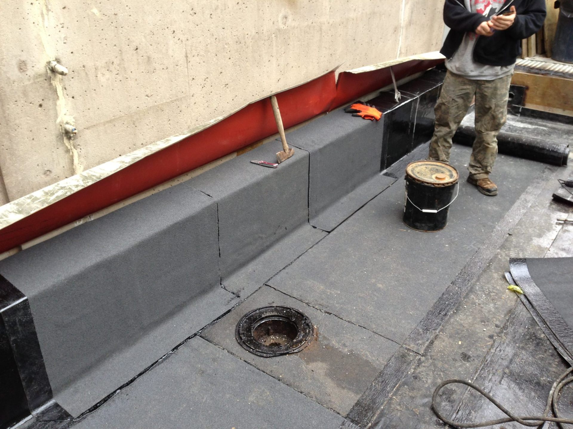 Torch-on parapet and drain detail on commercial building in Vancouver, BC by Roofking
