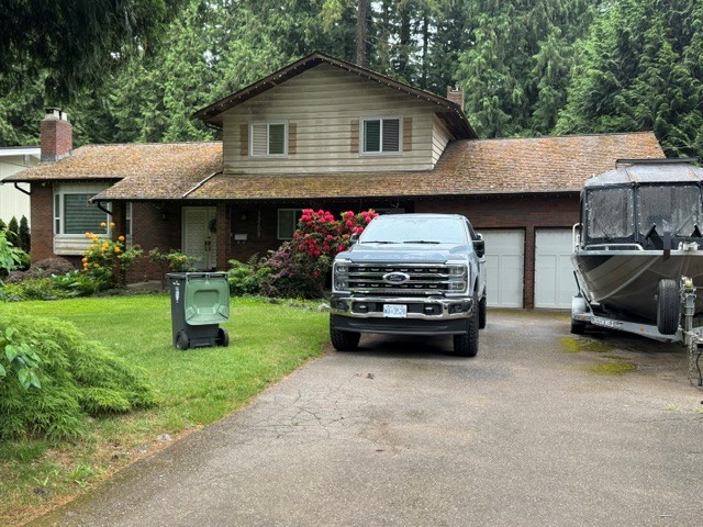 Moss-covered residential roof pre-replacement in Coquitlam, BC by Roofking